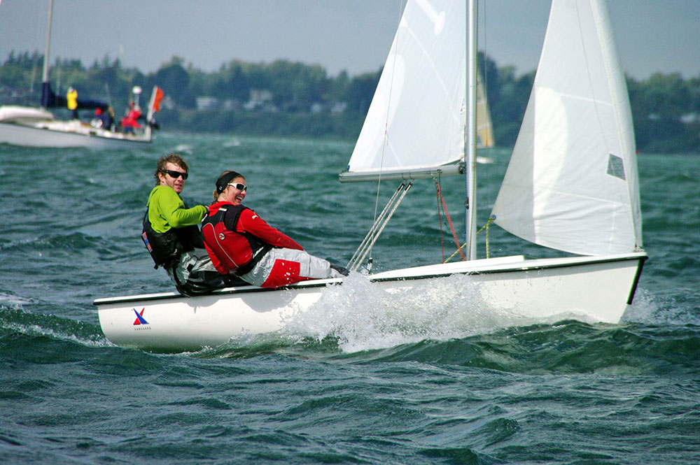 Sarah with her friend and skipper Pete McGrath, sailing on Bellingham Bay for Western Washington University.