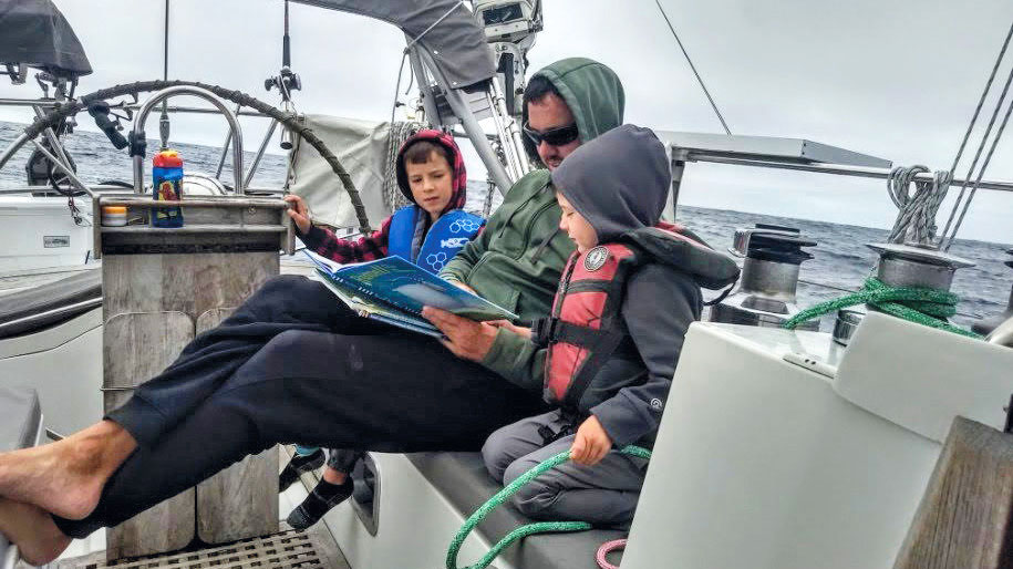 Andy and his boys, Porter and Magnus, on passage from Alaska to San Francisco.
