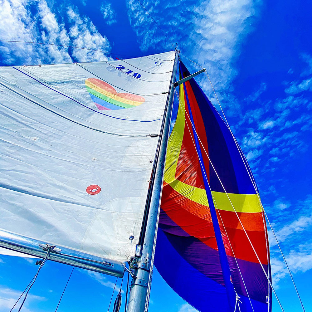 Jenn Harkness has rainbow sails on her Ranger 29, Poop Deck. Love is love. Love wins.